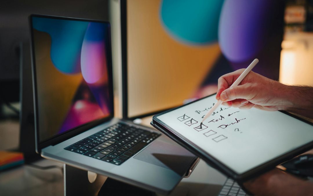 person at work marking a checklist on tablet