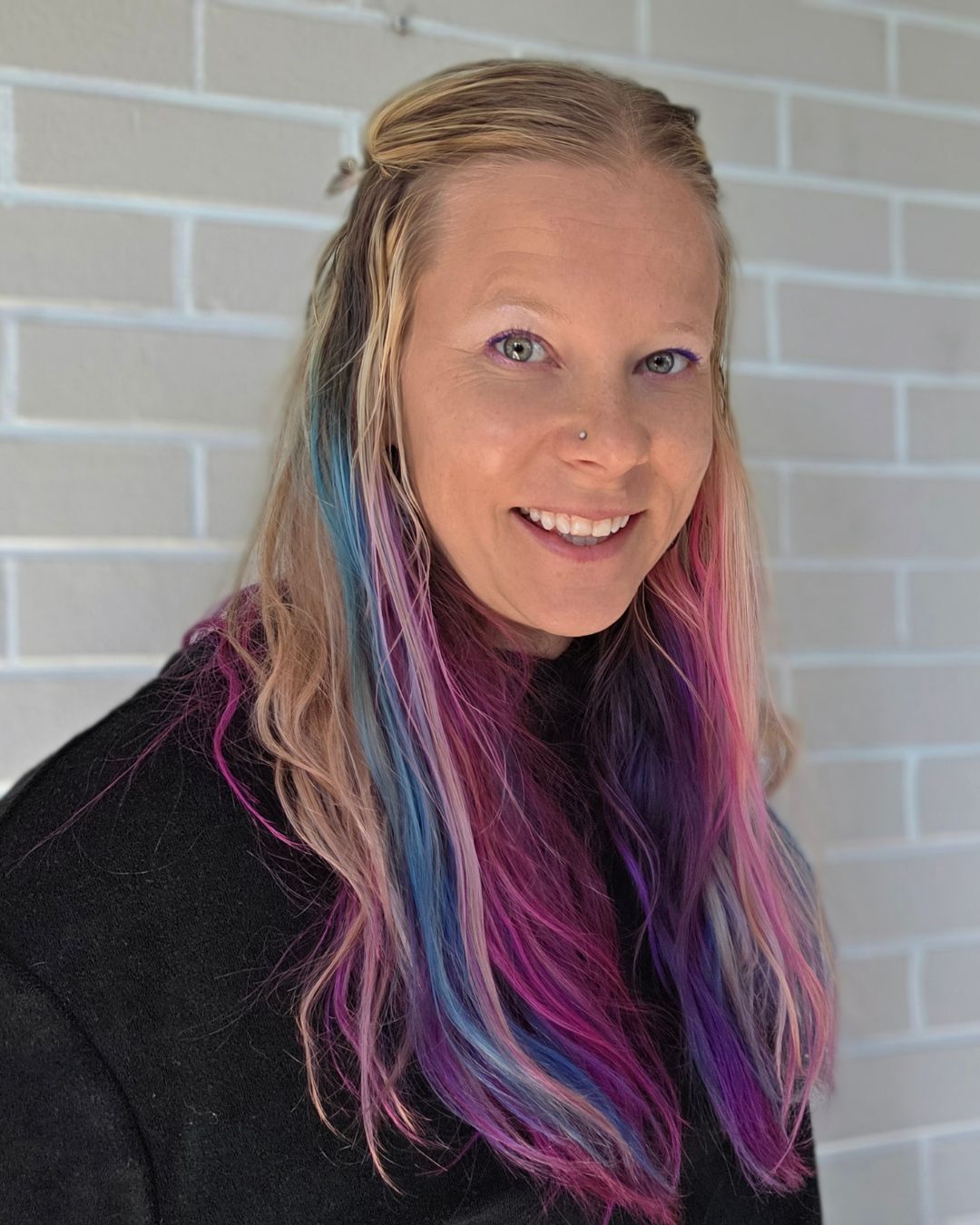 Dr. Saara Bio Headshot in Black Top