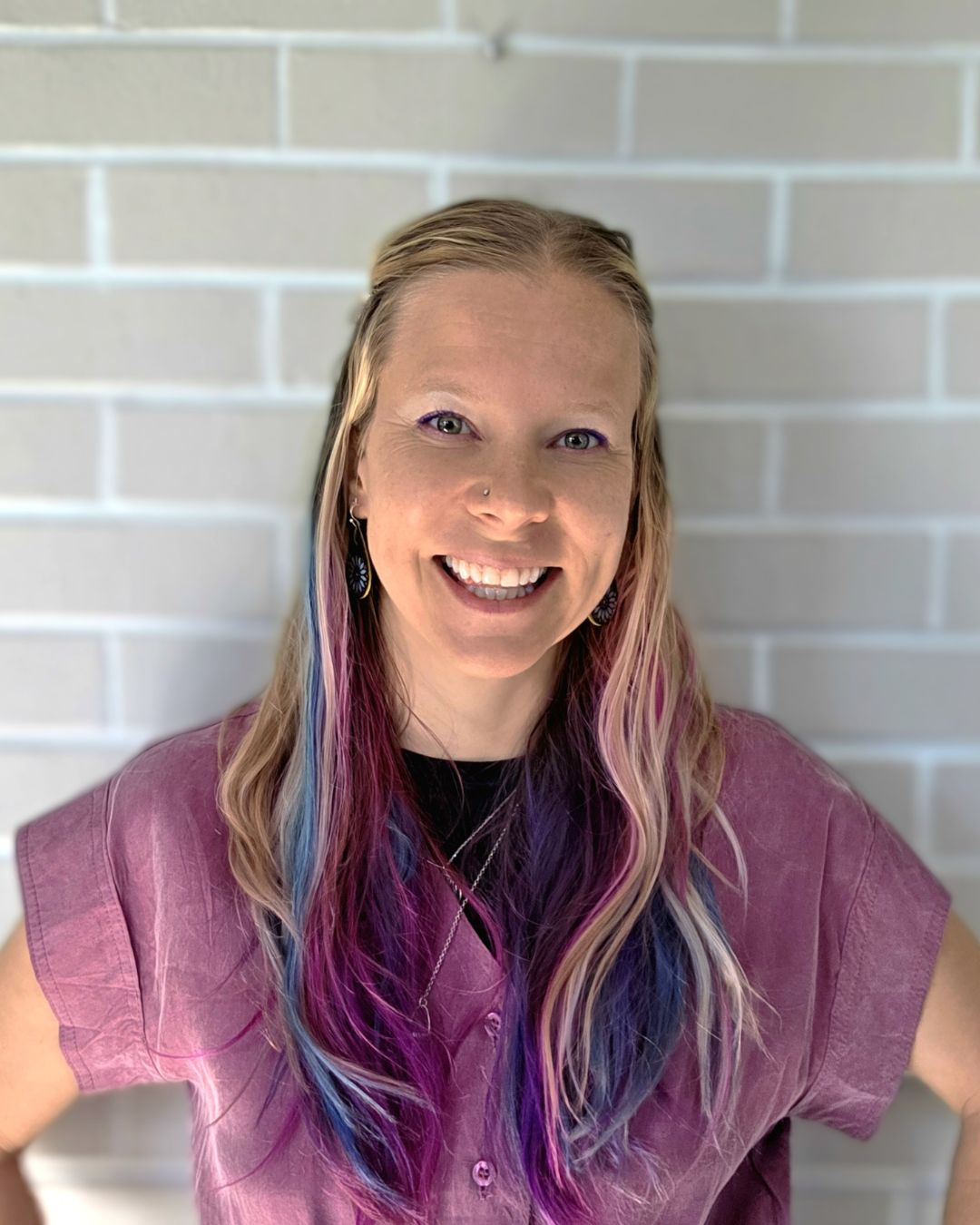 Dr. Saara Bio Headshot in Purple Top